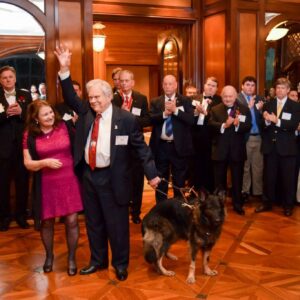 man raising hand crowd cheering