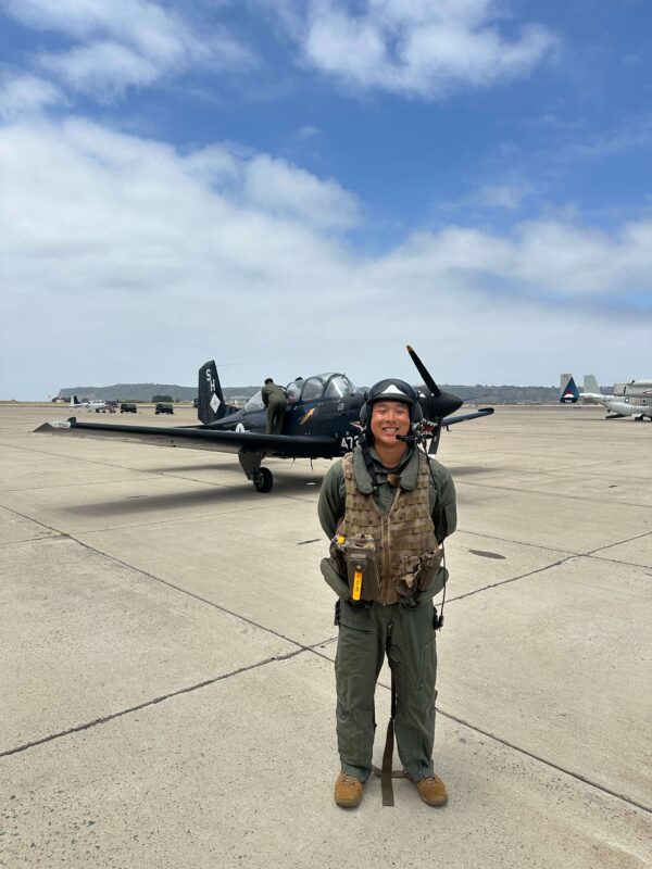 Jared Tam in front of jet