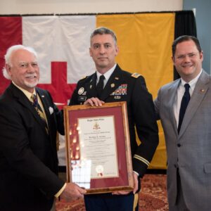 three men with certificate