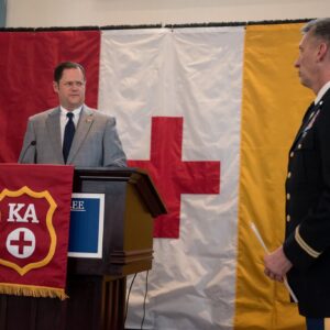 man talking at podium