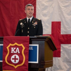 man talking at podium