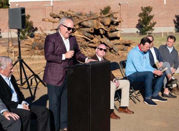 speaker at podium with listeners