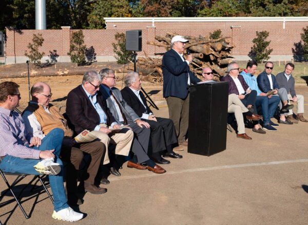 speaker at podium with listeners
